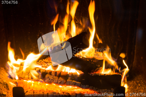 Image of close up of firewood burning in fireplace