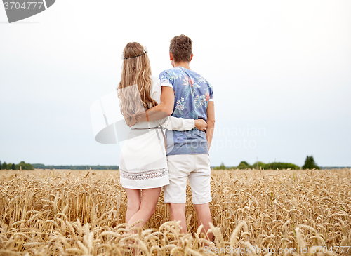 Image of happy smiling young hippie couple outdoors