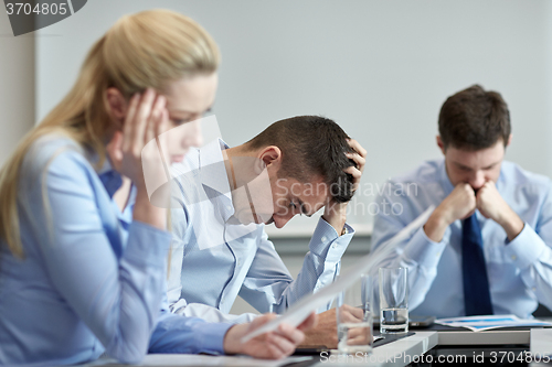 Image of business people having problem in office