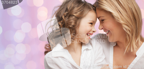 Image of happy mother and daughter hugging