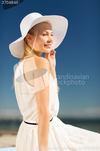 Image of beautiful woman enjoying summer outdoors