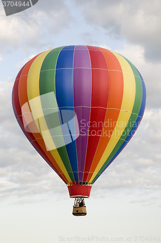 Image of Hot-Air Balloon Floating Among Clouds