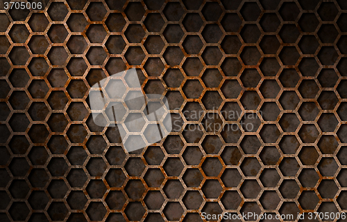 Image of Rusty hexagon pattern grate texture lit diagonally