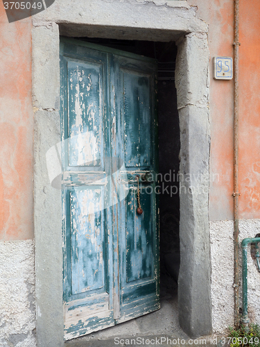 Image of Riomaggiore Cinque Terre ancient wooden door weatherbeaten by  s