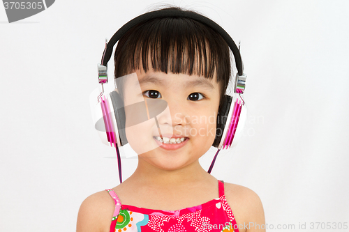 Image of Chinese little girl on headphones