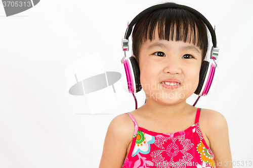 Image of Chinese little girl on headphones