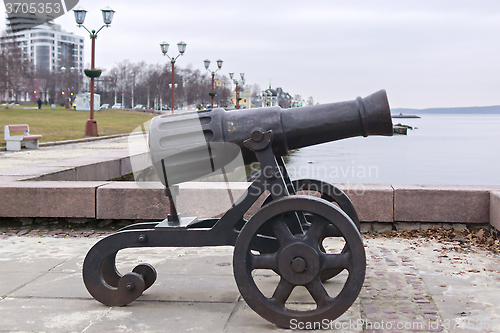 Image of Decorative cannon on city lake quay