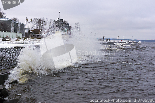 Image of Storm on city lake quay in winter