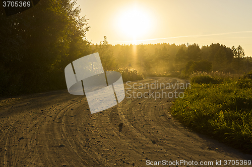 Image of Rural dirt road at sunset
