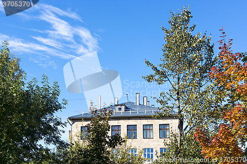 Image of Old house of school in autumn day