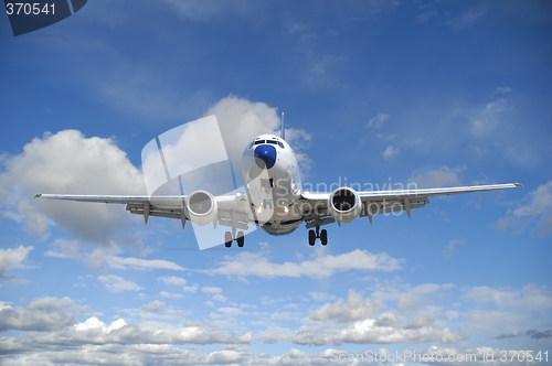 Image of Air travel - Plane is flying in blue sky with clouds