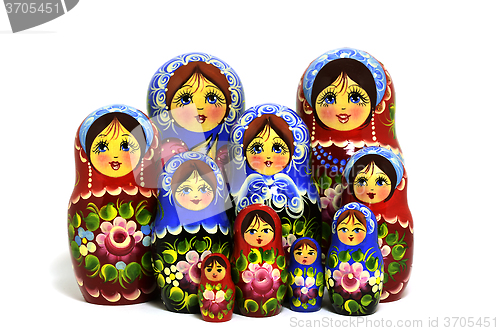 Image of lot of traditional Russian matryoshka dolls on white