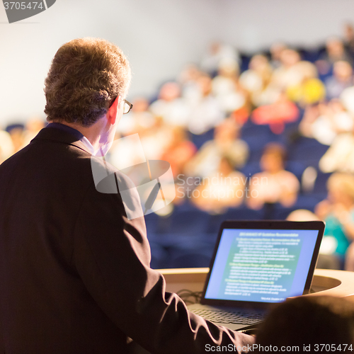 Image of Speaker at Business Conference and Presentation.