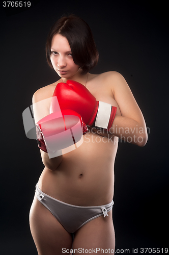 Image of beautiful nude girl with boxing gloves