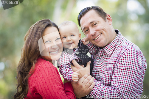 Image of Little Baby Boy Having Fun With Mother and Father Outdoors