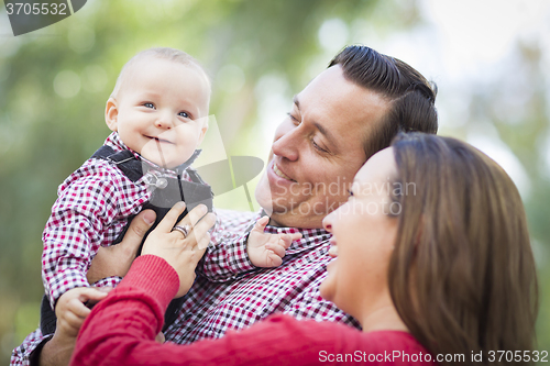 Image of Little Baby Boy Having Fun With Mother and Father Outdoors