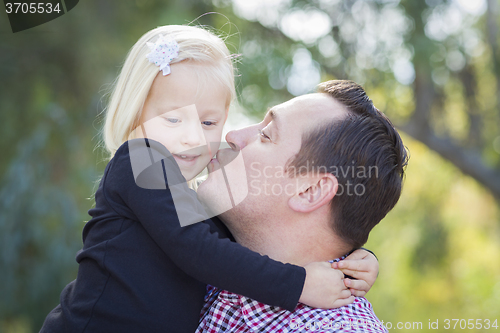 Image of Father Kissing Adorable Little Girl Outdoors