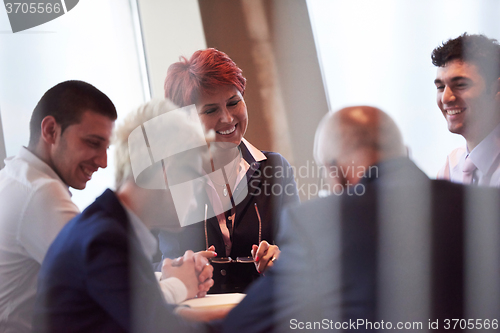 Image of business people group on meeting at modern bright office