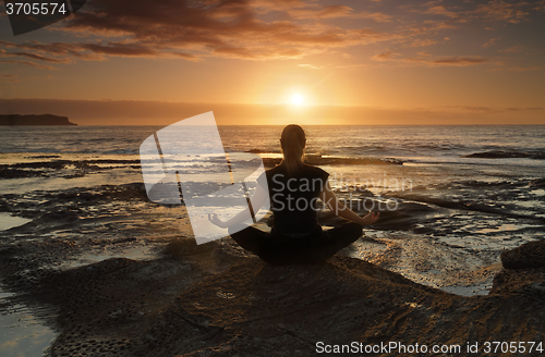 Image of Meditating or yoga by the sea