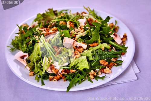 Image of salad with pear, walnuts