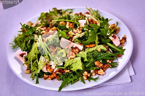 Image of salad with pear, walnuts