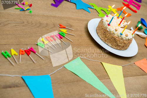 Image of Birthday Cake And Decorations On Table