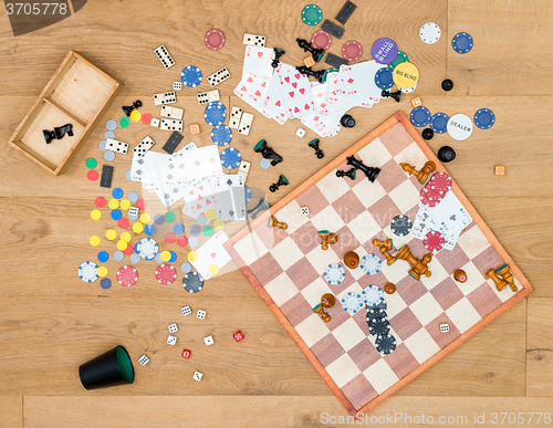 Image of Various Leisure Games Spread On Wooden Table