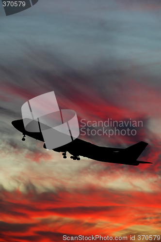 Image of Silhouette of plane and sunset