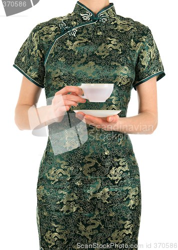 Image of Woman in Chinese dress holding a cup of tea