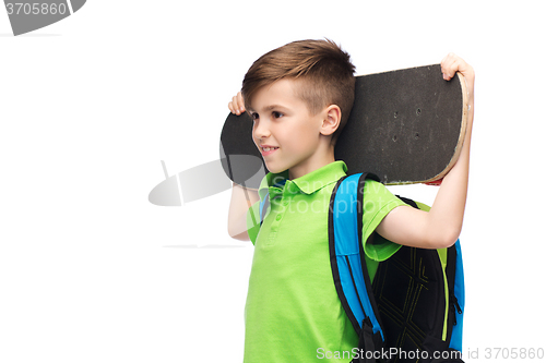 Image of happy student boy with backpack and skateboard