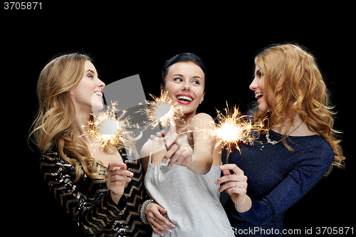 Image of happy young women dancing at night club disco