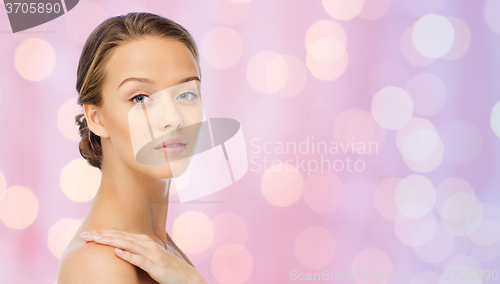 Image of smiling young woman face and shoulders