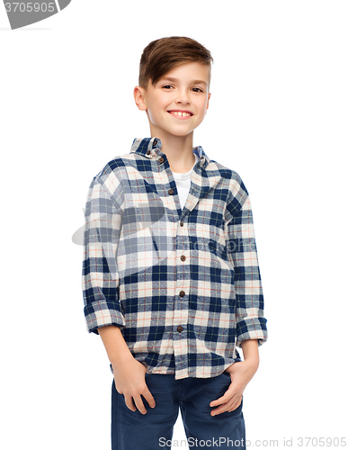 Image of smiling boy in checkered shirt and jeans