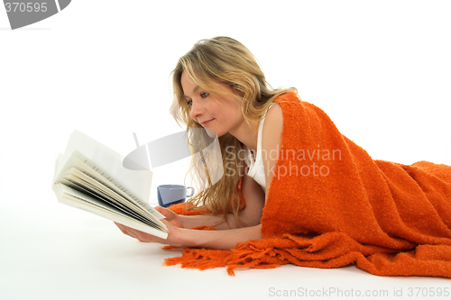 Image of Nice girl reading a book, relaxed