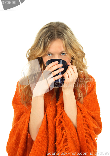 Image of Cozy girl enjoying a cup of tea