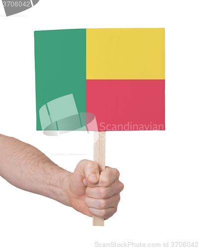 Image of Hand holding small card - Flag of Benin