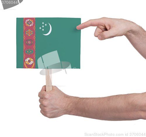 Image of Hand holding small card - Flag of Turkmenistan