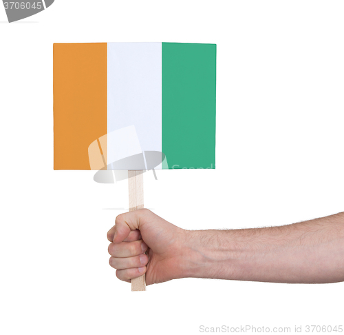 Image of Hand holding small card - Flag of Ivory Coast