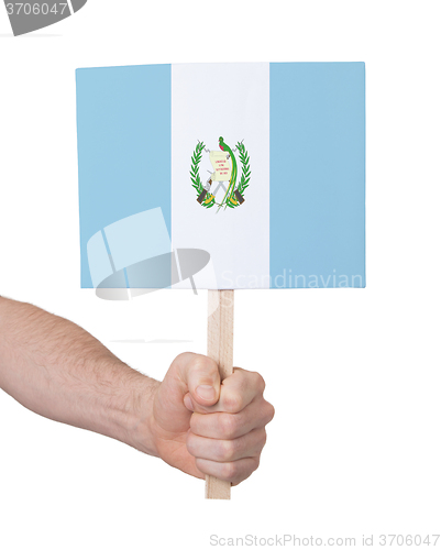 Image of Hand holding small card - Flag of Guatemala