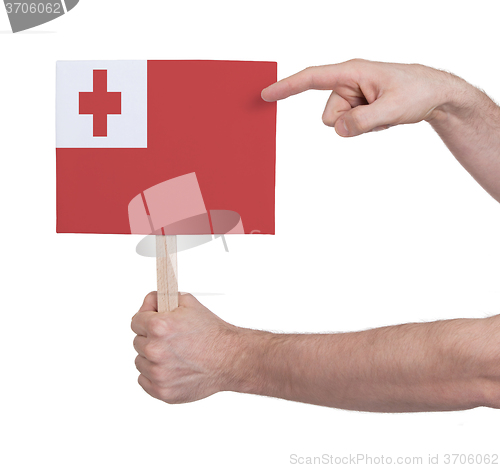 Image of Hand holding small card - Flag of Tonga