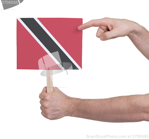 Image of Hand holding small card - Flag of Trinidad and Tobago