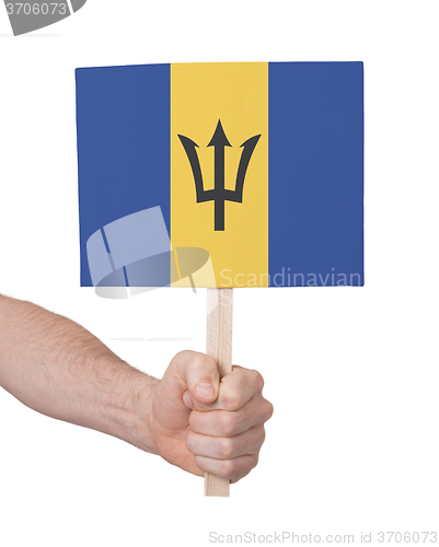 Image of Hand holding small card - Flag of Barbados