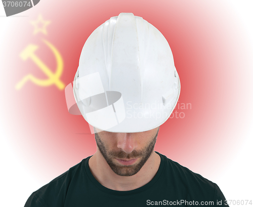 Image of Engineer with flag on background - USSR