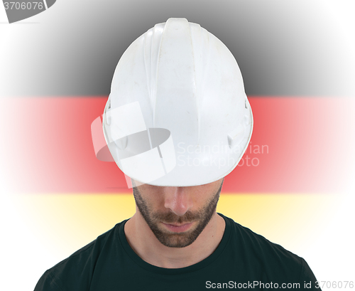 Image of Engineer with flag on background - Germany