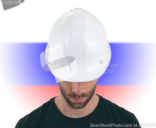 Image of Engineer with flag on background - Russia