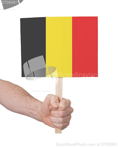 Image of Hand holding small card - Flag of Belgium