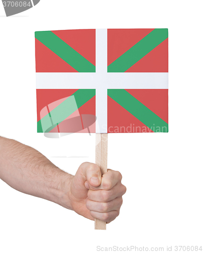 Image of Hand holding small card - Flag of Basque Country