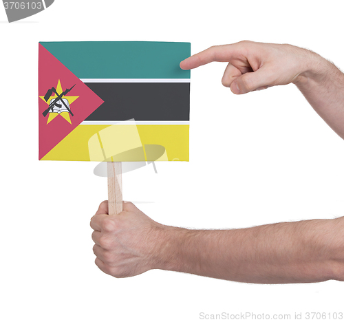 Image of Hand holding small card - Flag of Mozambique