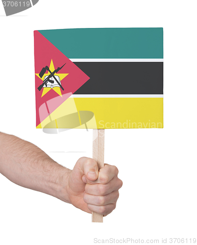 Image of Hand holding small card - Flag of Mozambique