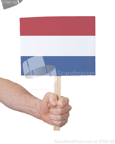 Image of Hand holding small card - Flag of the Netherlands